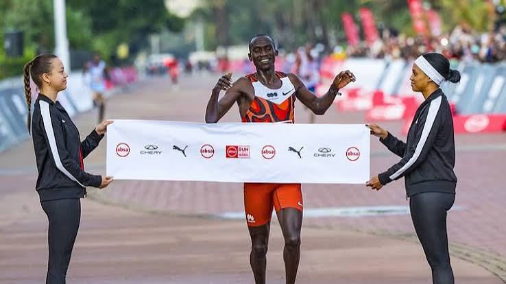 Long-distance runner crossing a finish line