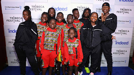 A group of young dancers performing energetically