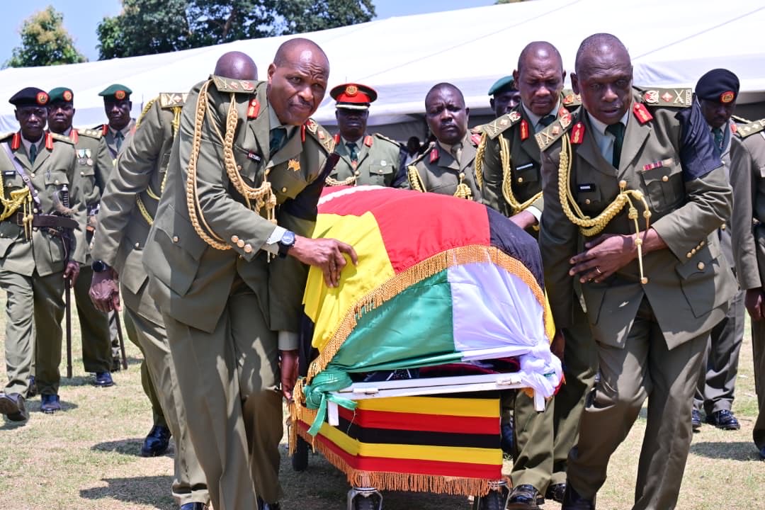 Mourners gathered at a burial ceremony in Adjumani
