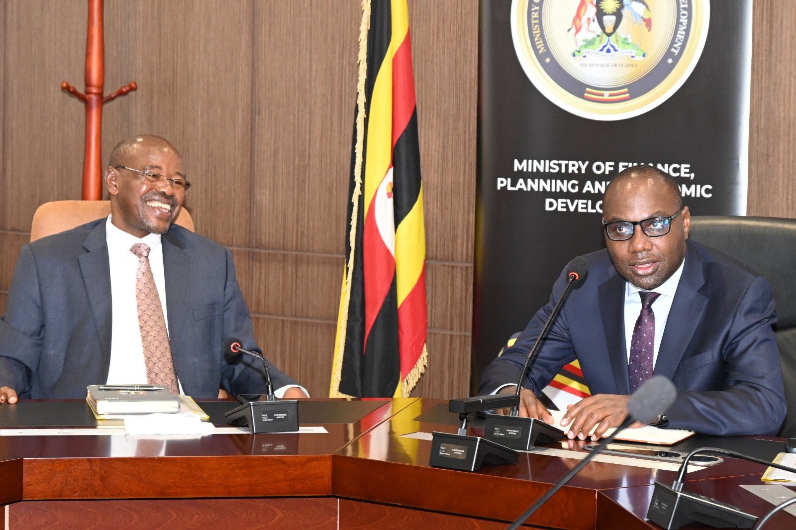 Finance Minister Henry Musasizi and State Minister Amos Lugoloobi meeting the Enterprise Uganda Board  