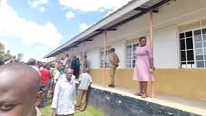 Dilapidated school toilet block made of rusted iron sheets