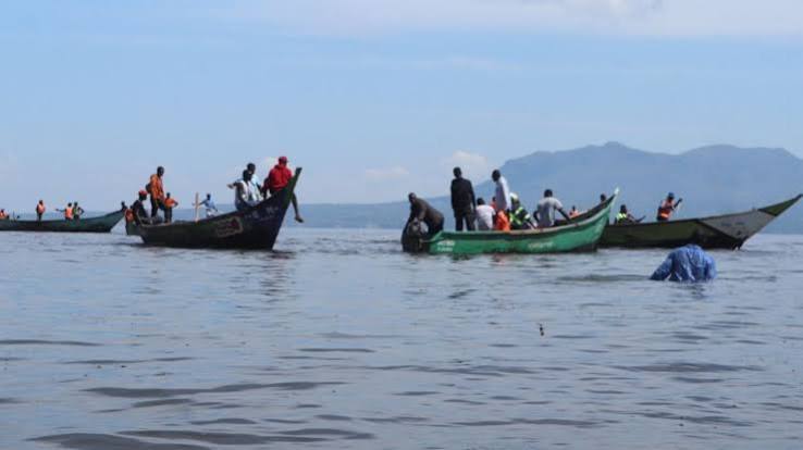 Fishing boats docked on the shore of Lake Victoria