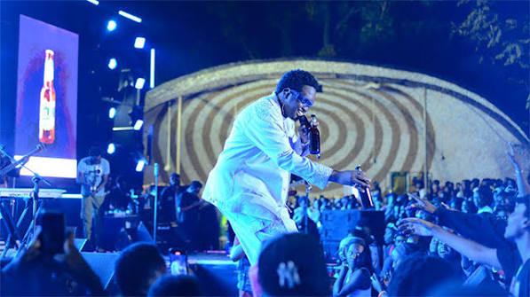 Concert crowd with stage lighting at a Kampala venue