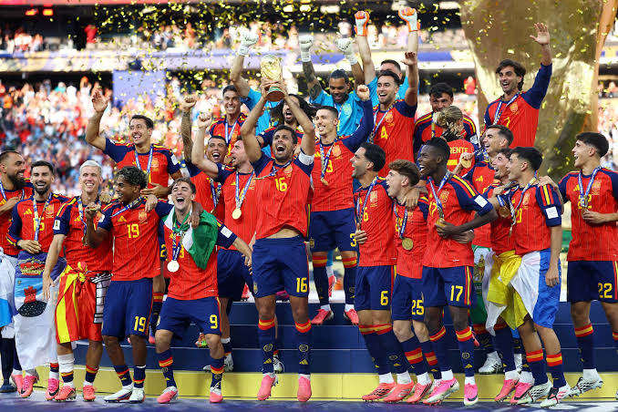 Spain players celebrating with the World Cup trophy